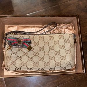 Authentic Gucci wristlet rarely worn (less than 5 times)